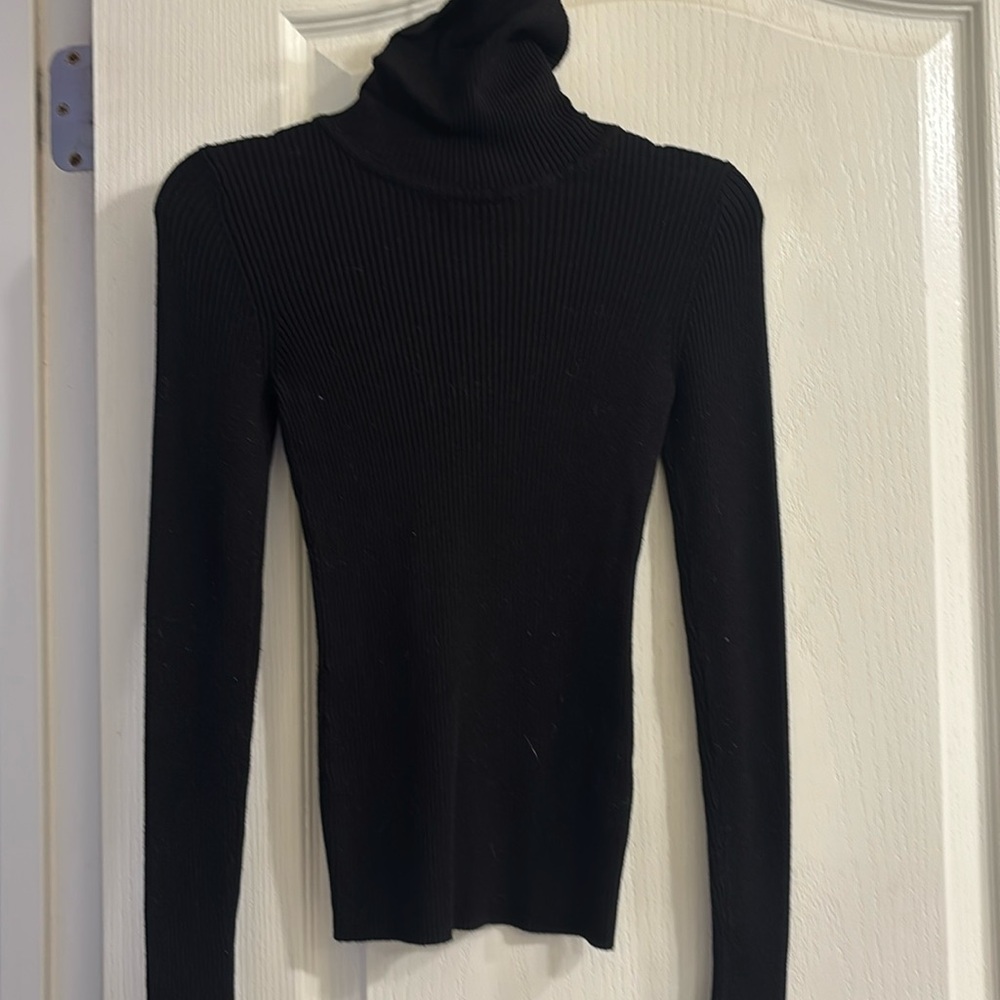 black tight fitting turtleneck